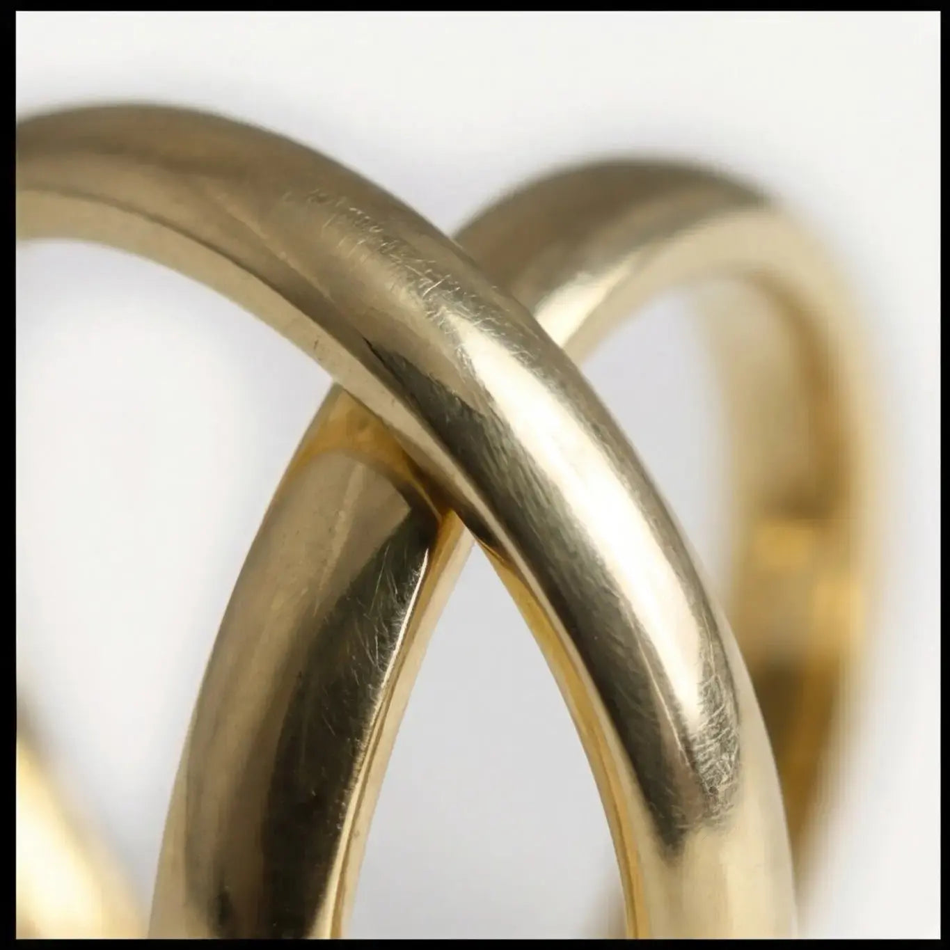A 3mm gold wedding band featuring a classic lyra design in 9ct gold, displayed horizontally with a subtle shine by Majestic J
