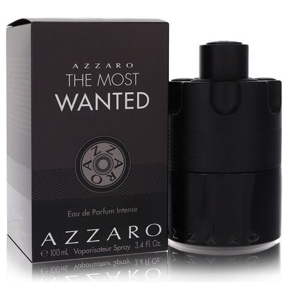 Azzaro The Most Wanted Eau De Parfum Intense spray bottle in black glass with gold accents on a wooden surface by The Fragran