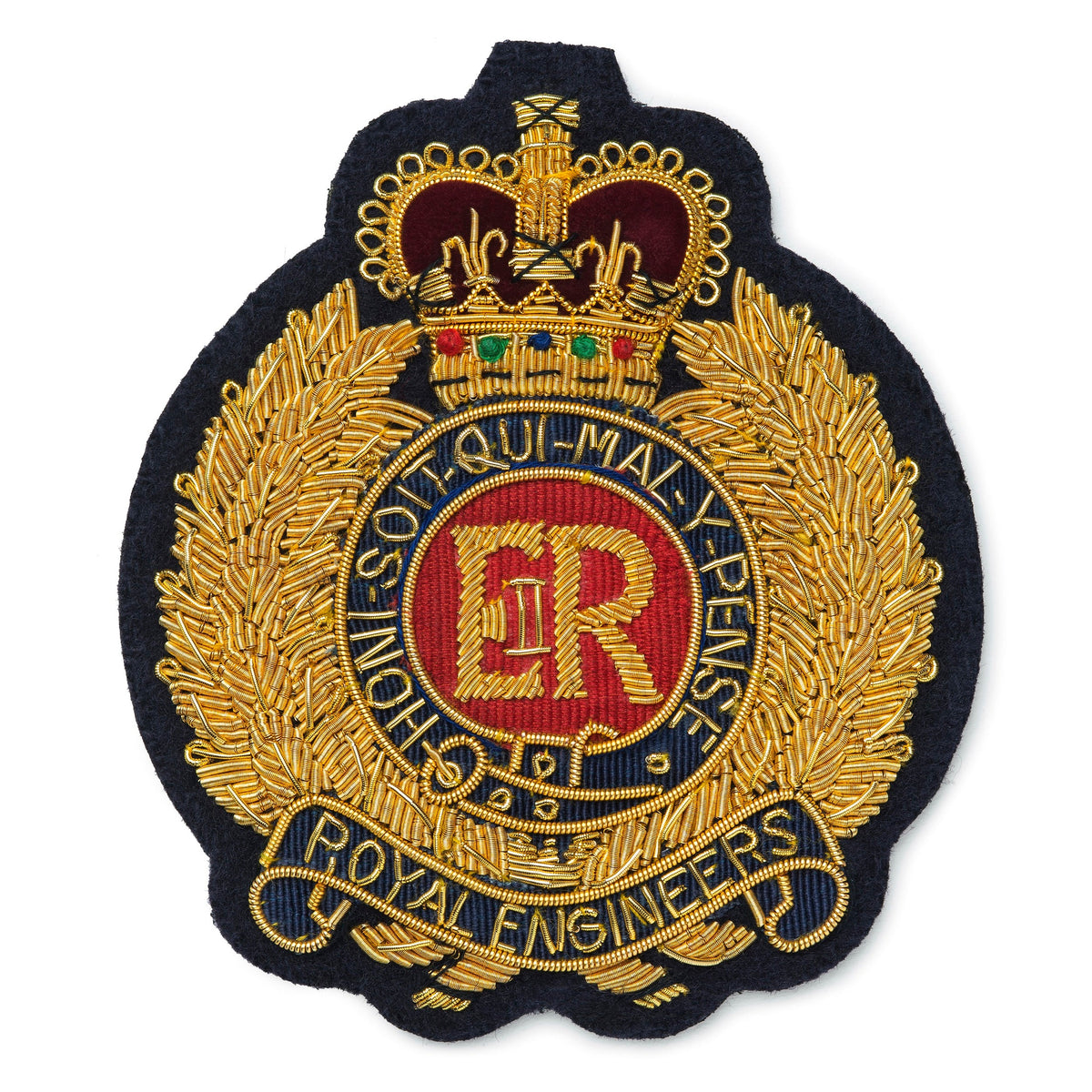 Royal Engineers blazer badge in gold with black enamel, featuring a crossed rifle and pickaxe, mounted on a dark blue backgro