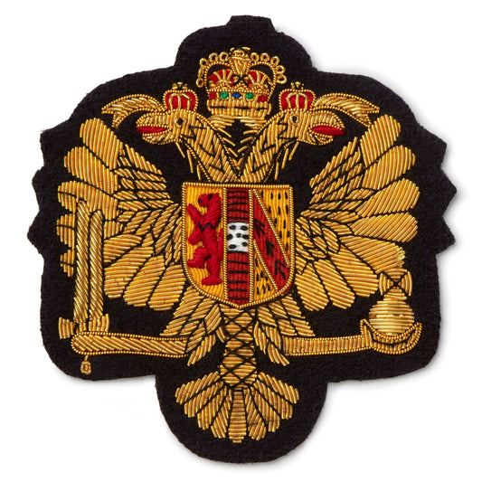 Black blazer badge with gold detailing and the Kings Dragoon Guards emblem, displayed on a white background by Benson & Clegg