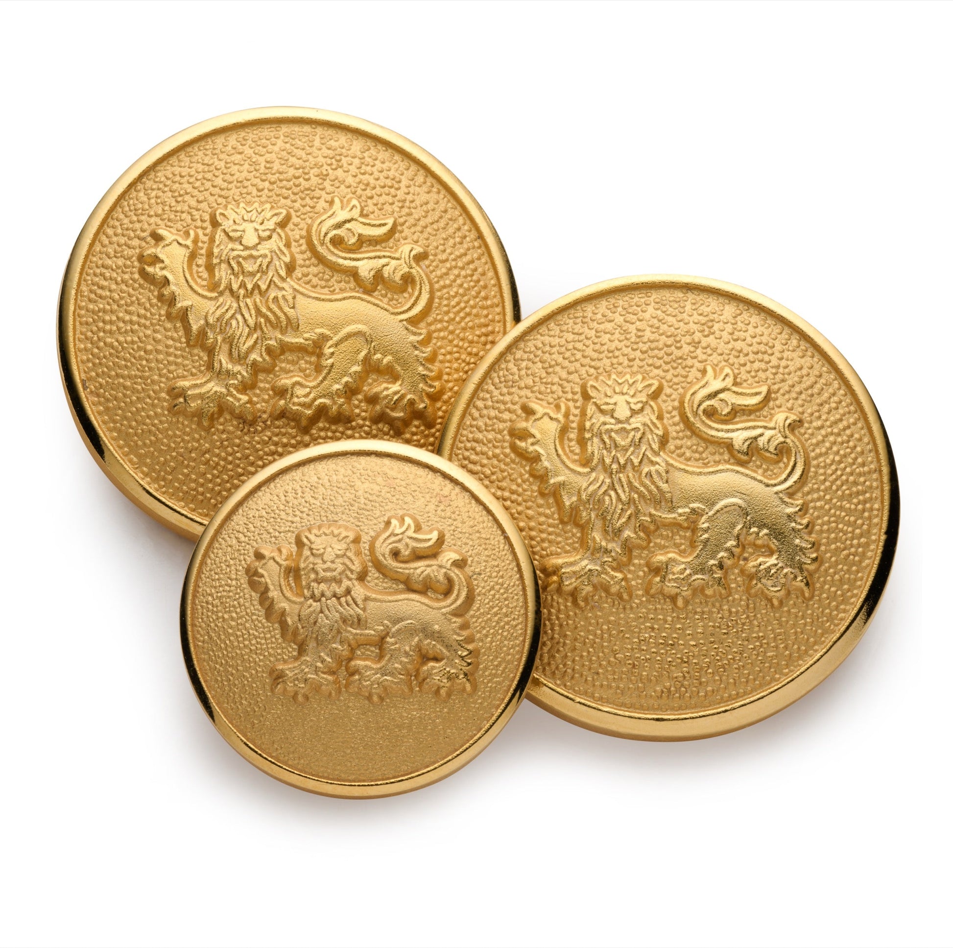 A gold lion passant guardant blazer button on a black background, detailed engravings, by Benson & Clegg.