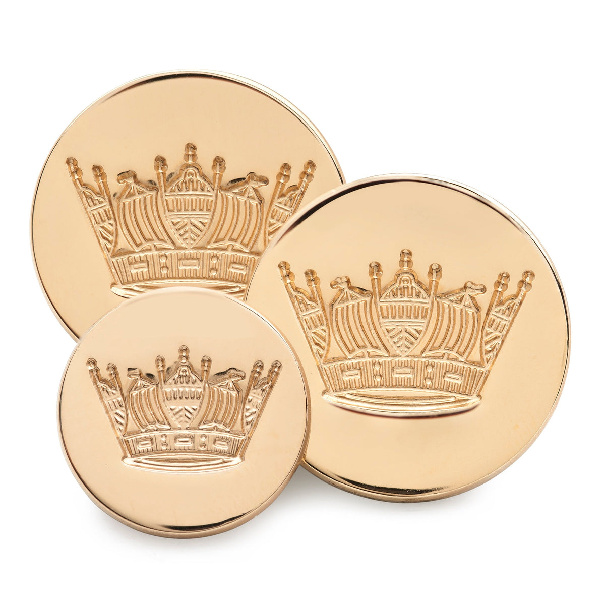 Gold blazer button set with naval coronet design, featured on a dark blue fabric backdrop by Benson & Clegg.