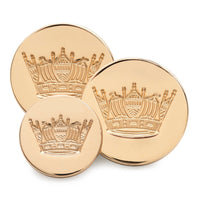 Gold blazer button set with naval coronet design, featured on a dark blue fabric backdrop by Benson & Clegg.