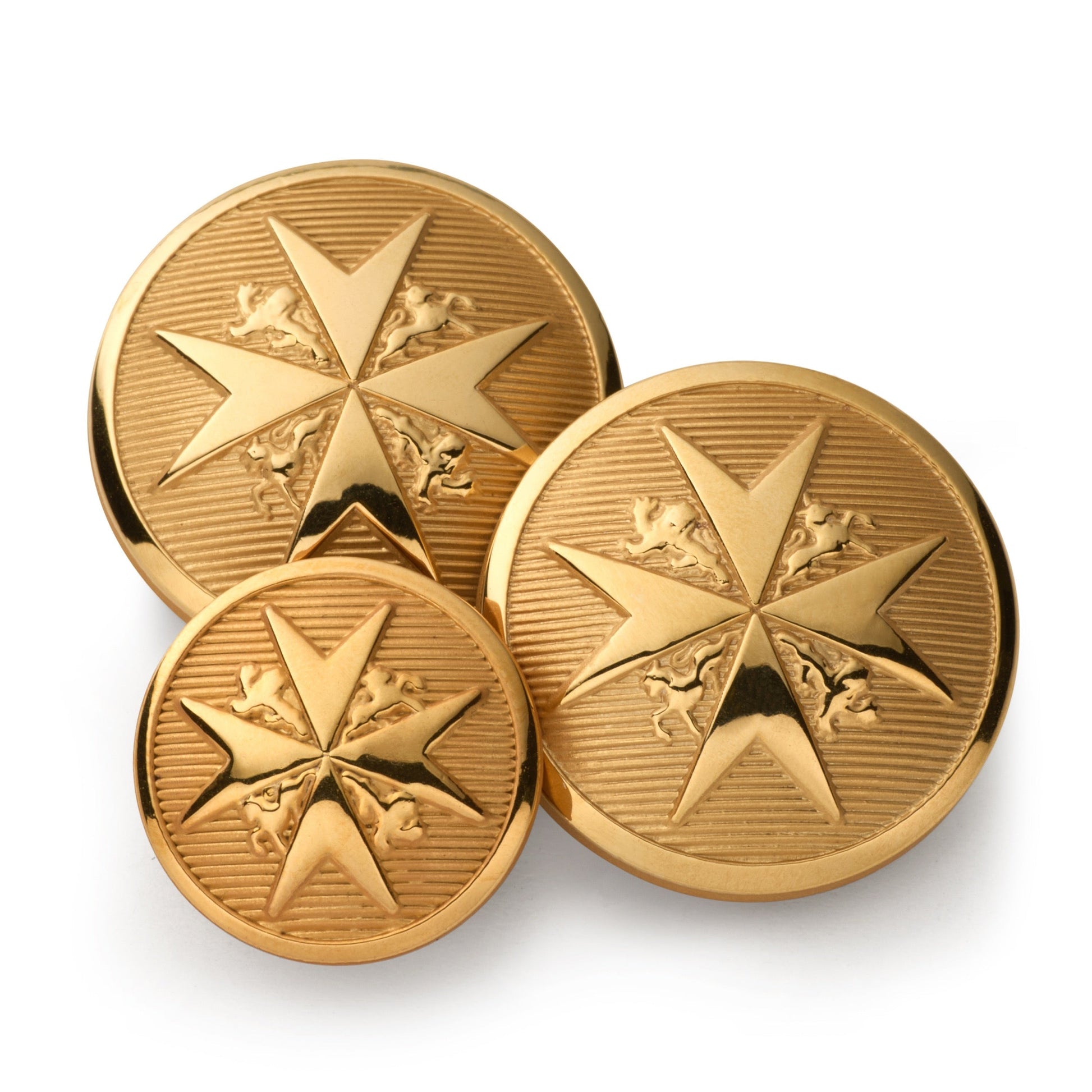 Black maltese cross blazer button set displayed on a wooden table, featuring intricate detailing and polished finish by Benso