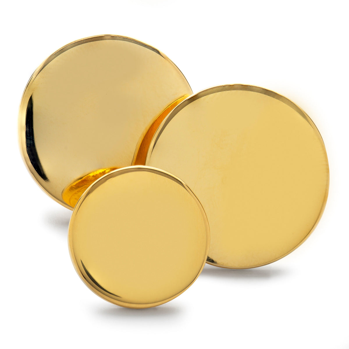 Polished gold blazer buttons set displayed on a black velvet background by Benson & Clegg.