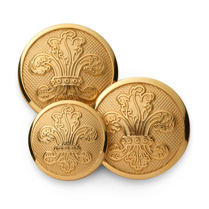 Gold fleur de lys blazer button with detailed engravings on a dark background by Benson & Clegg.