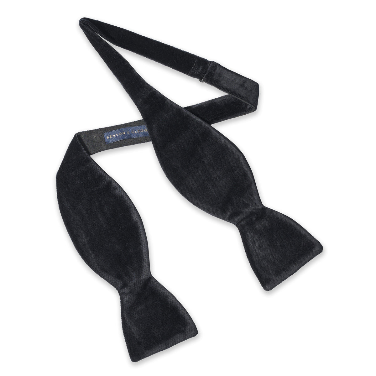 Black velvet self-tie bow tie in deep black with polished finish by Benson & Clegg