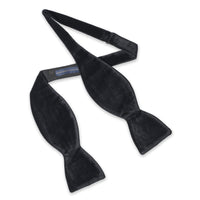 Black velvet self-tie bow tie in deep black with polished finish by Benson & Clegg