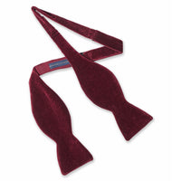 Dark red wine velvet self-tie bow tie with polished edges by Benson & Clegg