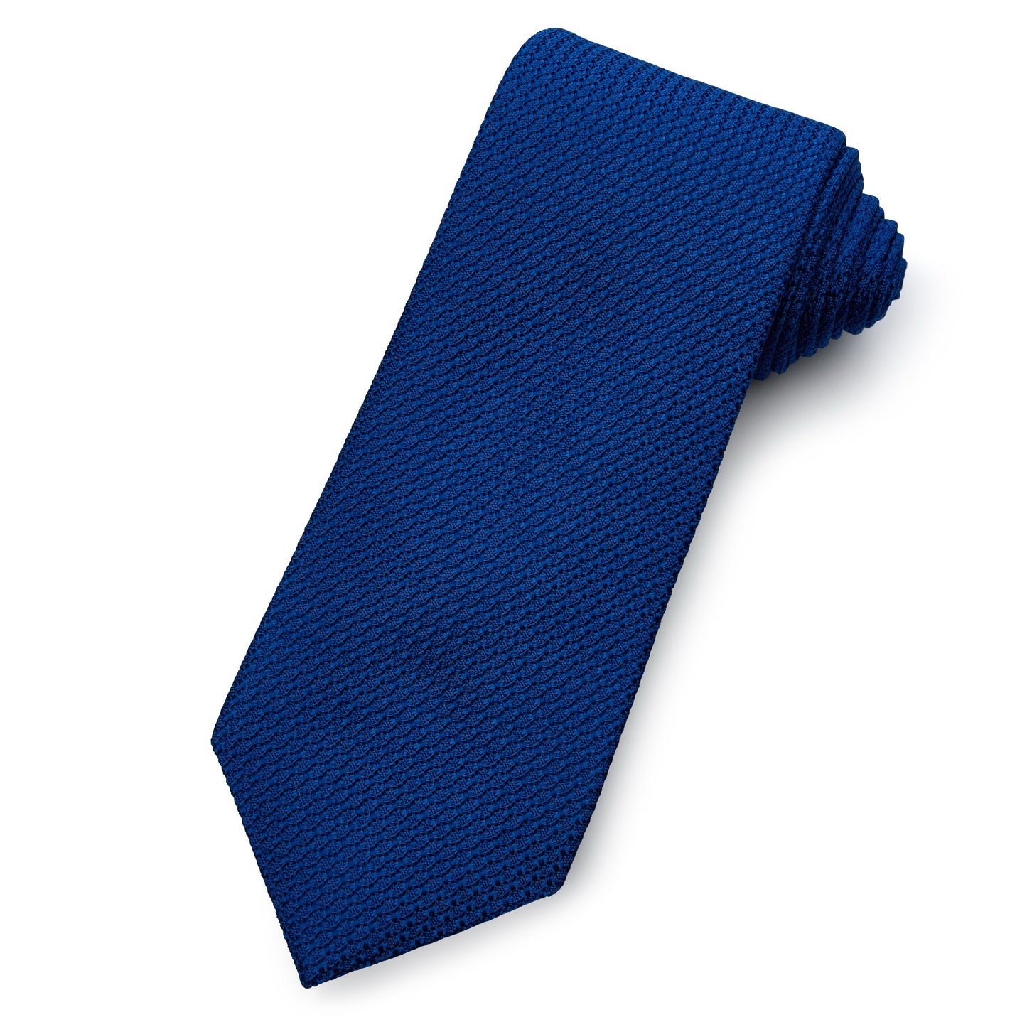 Royal blue grenadine silk tie with subtle texture, worn on a formal shirt by Benson & Clegg.