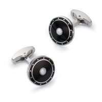 Black onyx cufflinks with a sleek silver finish, displayed on a dark background, featuring the Benson & Clegg logo.
