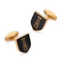 Black onyx cufflinks shaped like a heraldic tower shield by Benson & Clegg