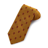 A golden silk tie featuring a rampant lion design, displayed horizontally with detailed texture and branding by Benson & Cleg
