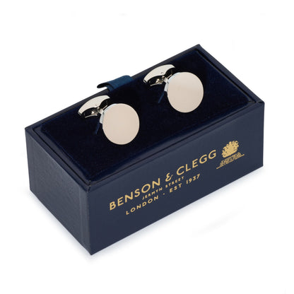 Silver round cufflinks with polished finish, styled on a white shirt cuff, by Benson & Clegg.