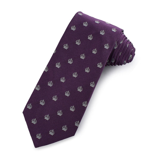 Purple silk tie with intricate pattern worn around a neck by Benson & Clegg