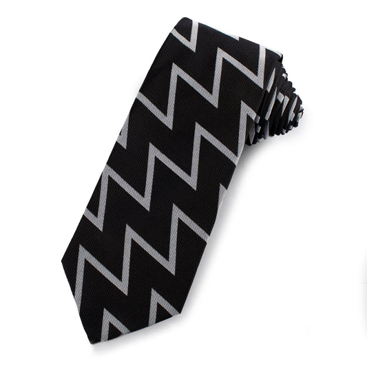 Black and silver silk tie with subtle sheen, styled around a collar, by Benson & Clegg.