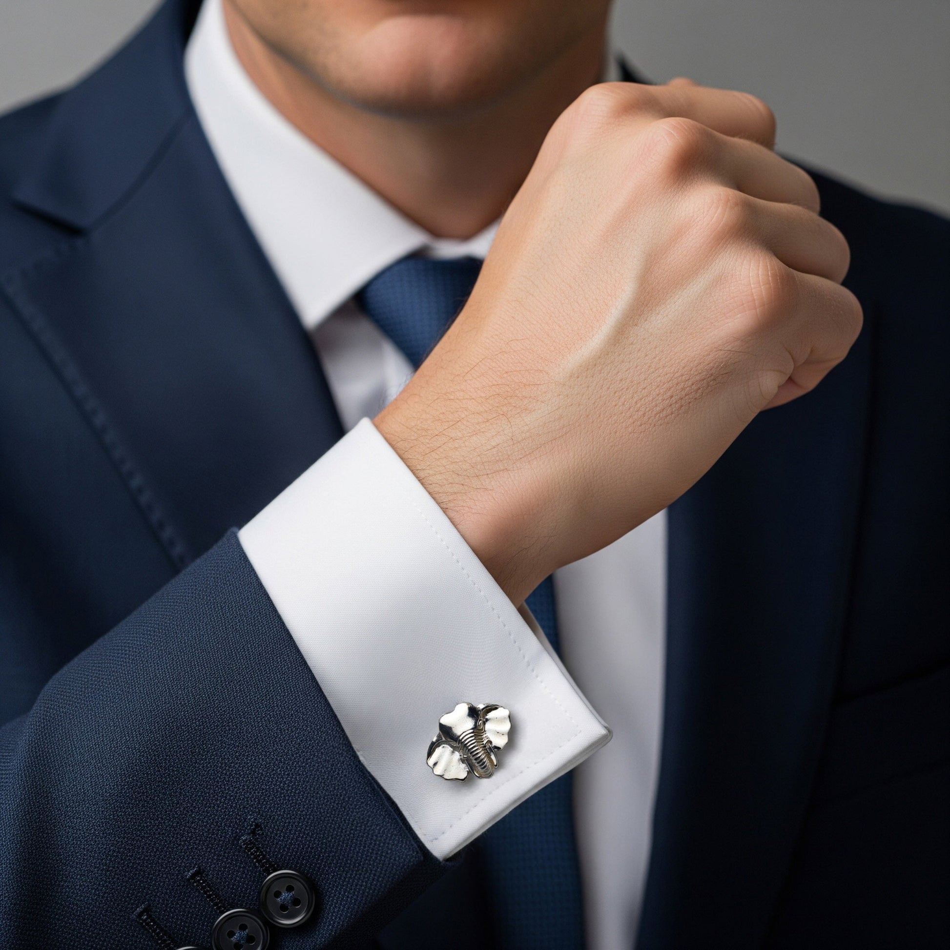 Sterling silver elephant head and tusk cufflinks with detailed carving by Benson & Clegg.