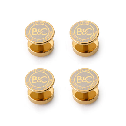 Gold dress studs featuring lapis lazuli gemstones, styled for formal wear by Benson & Clegg.