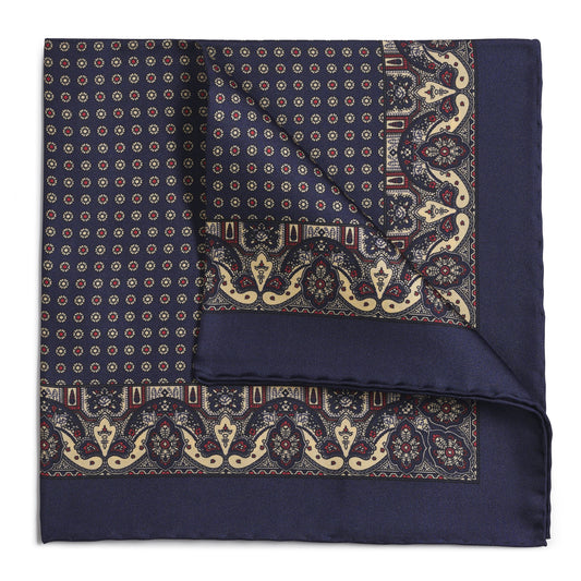 Navy silk pocket square with intricate paisley pattern, detailed embroidery, and ornate design by Benson & Clegg.