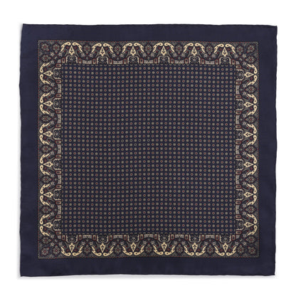 Navy silk pocket square with intricate paisley pattern, detailed embroidery, and elegant border.