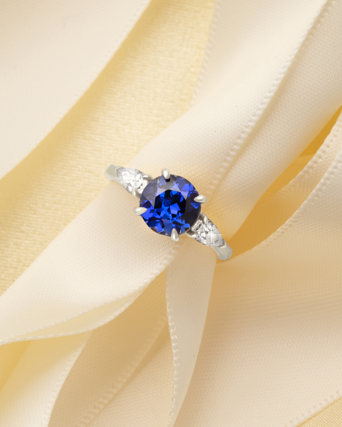 Blue Sapphire Round Cut Three Stone Engagement Ring in Sterling Silver - SJR London Timepiece