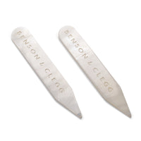 White mother of pearl collar stiffeners styled on a black shirt collar by Benson & Clegg.