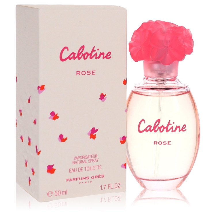 A pink glass bottle of Cabotine Rose Eau De Toilette spray for women by Parfums Gres on a white background.