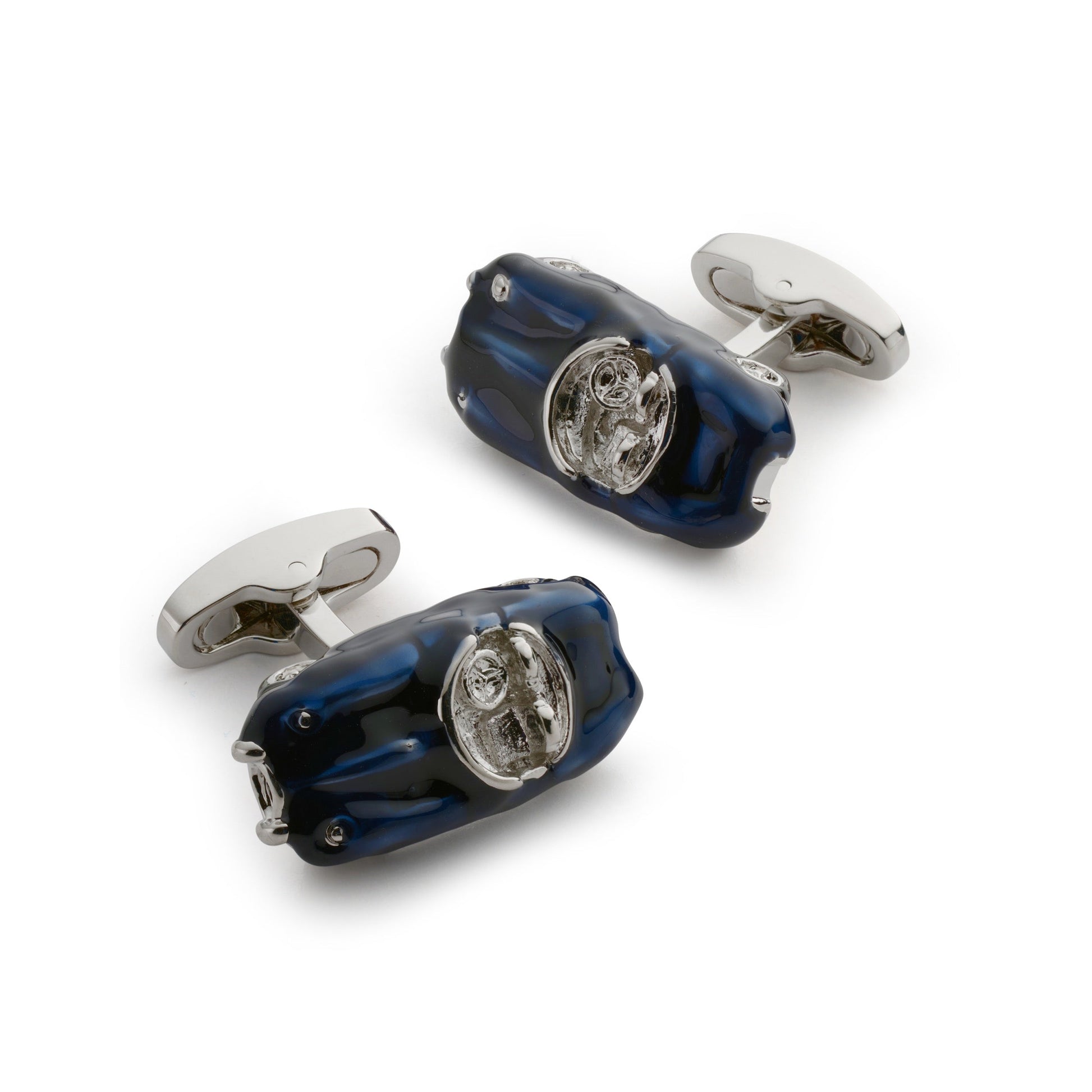 Black metal cufflinks with a sleek design worn on a formal shirt by Benson & Clegg.