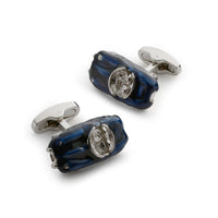 Black metal cufflinks with a sleek design worn on a formal shirt by Benson & Clegg.