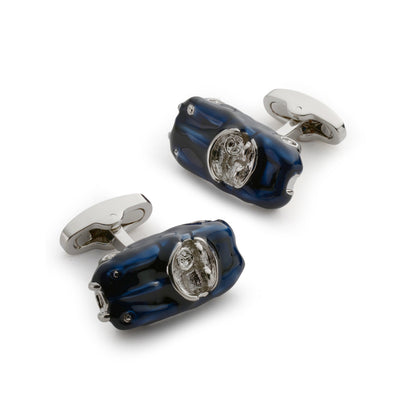 Black metal cufflinks with a sleek design worn on a formal shirt by Benson & Clegg.