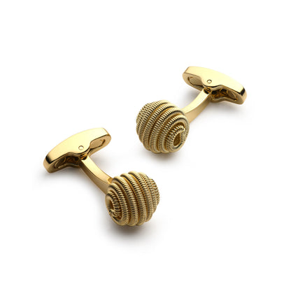 Gold spiral cufflinks with a polished finish, displayed on a black background, featuring the Benson & Clegg logo.