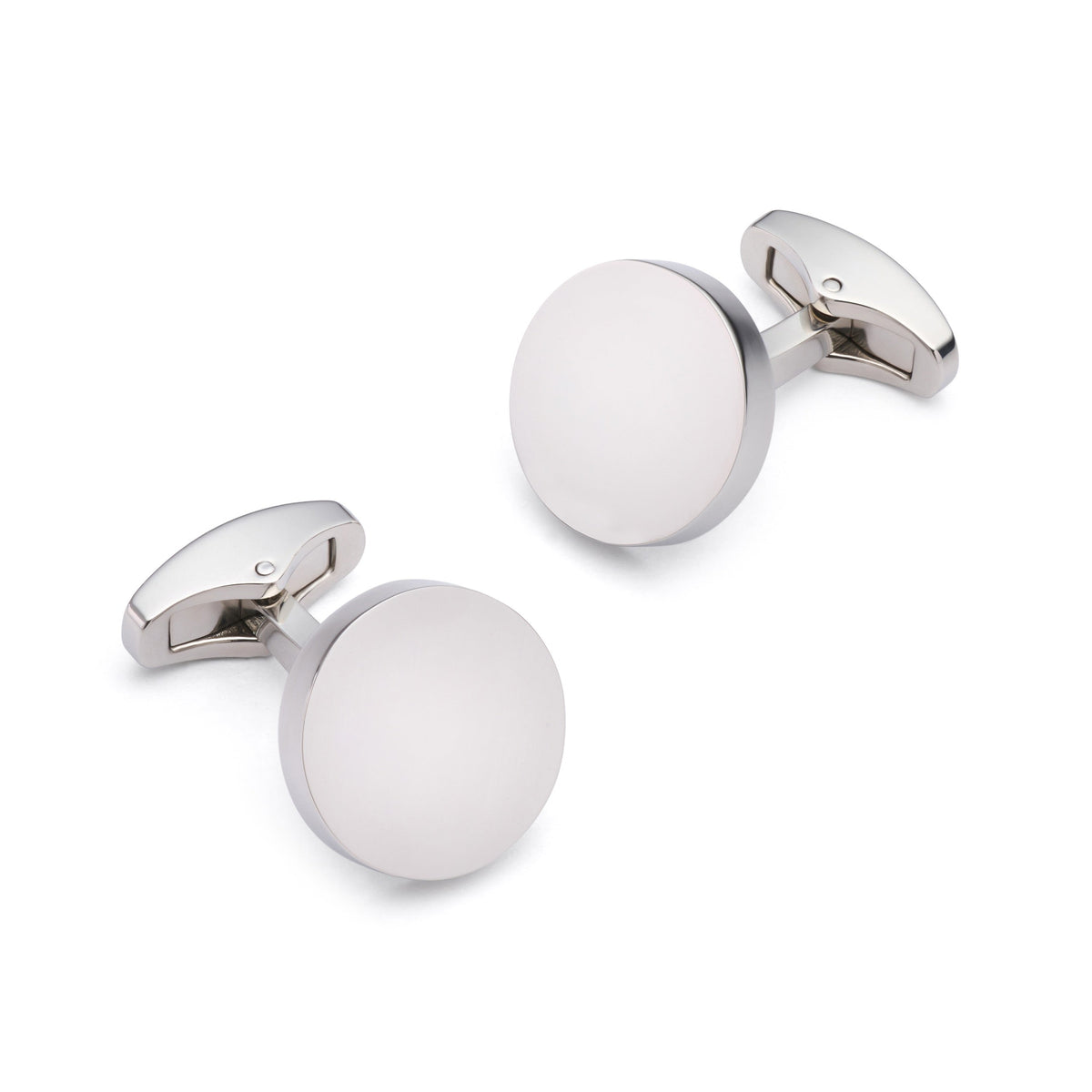 Silver round cufflinks with polished finish, styled on a white shirt cuff, by Benson & Clegg.