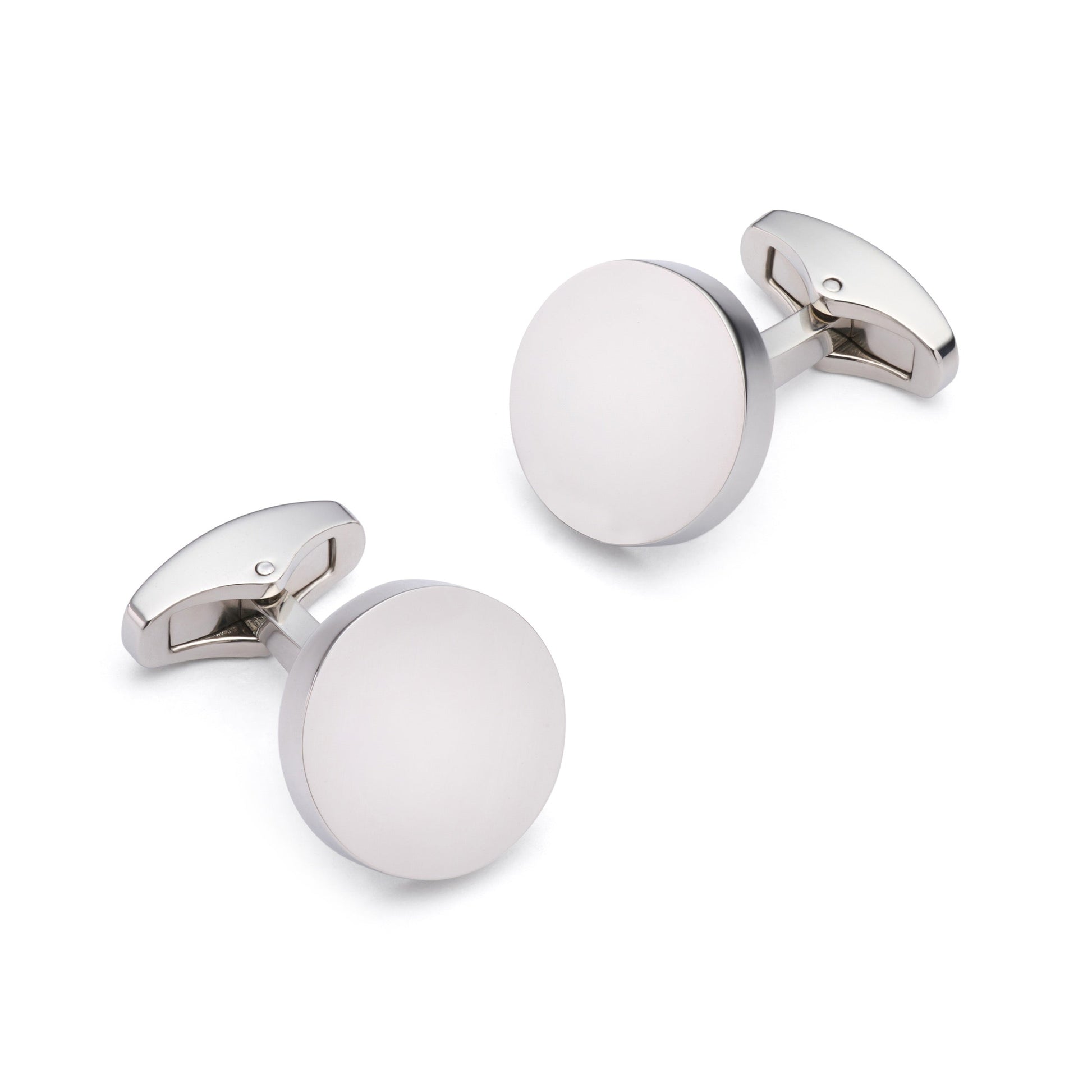Silver round cufflinks with polished finish, styled on a white shirt cuff, by Benson & Clegg.