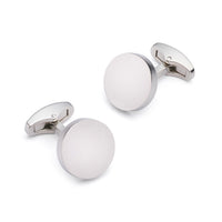 Silver round cufflinks with polished finish, styled on a white shirt cuff, by Benson & Clegg.