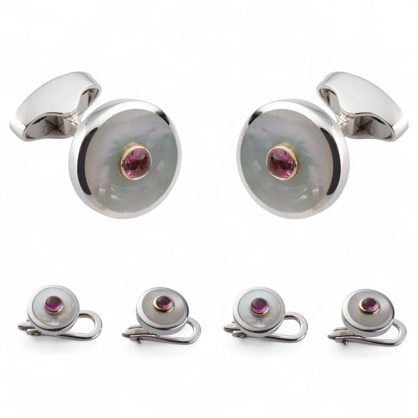 A pink tourmaline and sterling silver dress set displayed on a velvet tray by Benson & Clegg
