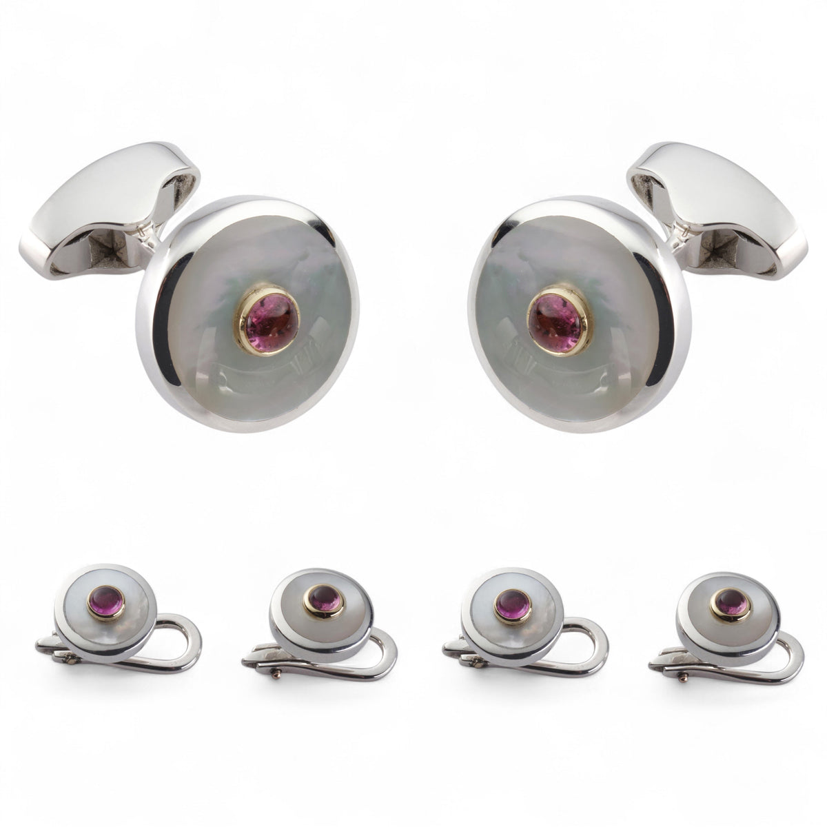 A pink tourmaline and sterling silver dress set displayed on a velvet tray by Benson & Clegg
