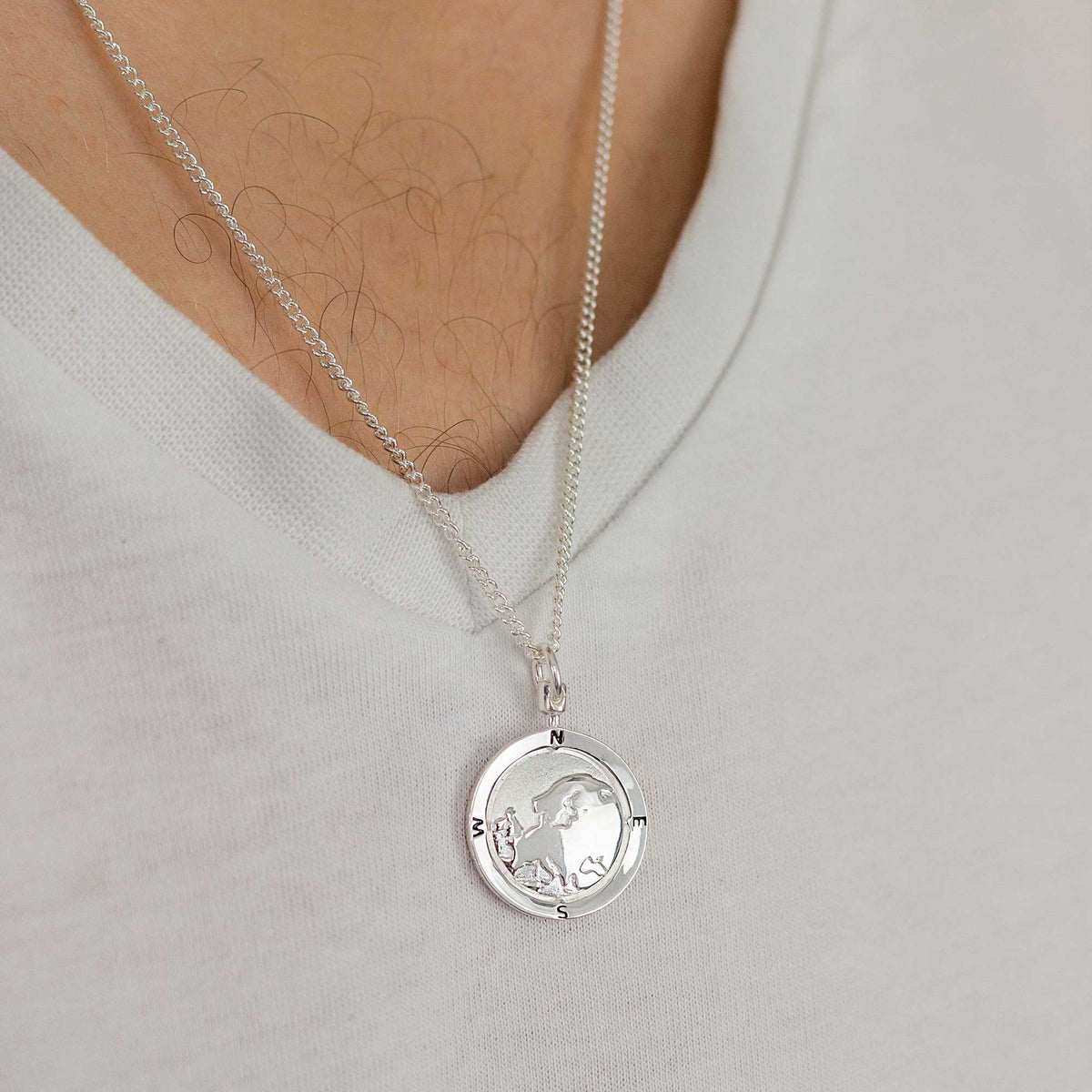 Silver chain necklace featuring a detailed Europe map globe with a personalisation option by Scarlett Jewellery.