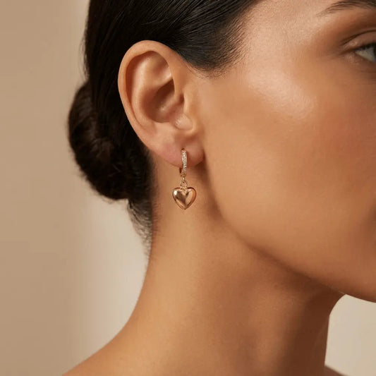 A golden heart drop hoop earring in 14ct gold by Majestic Jewellery