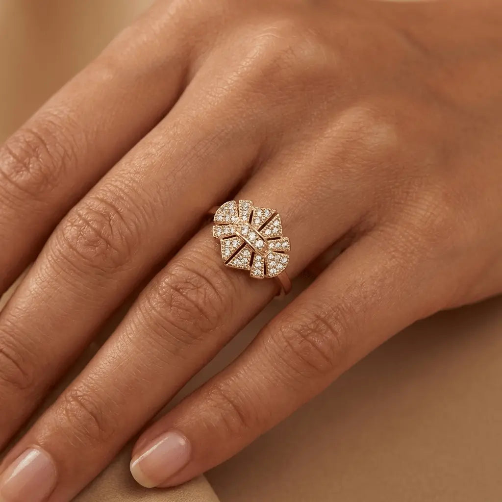 A solid gold ring with radiant brilliance displayed on a black stand, showcasing its 14ct gold material by Majestic Jewellery