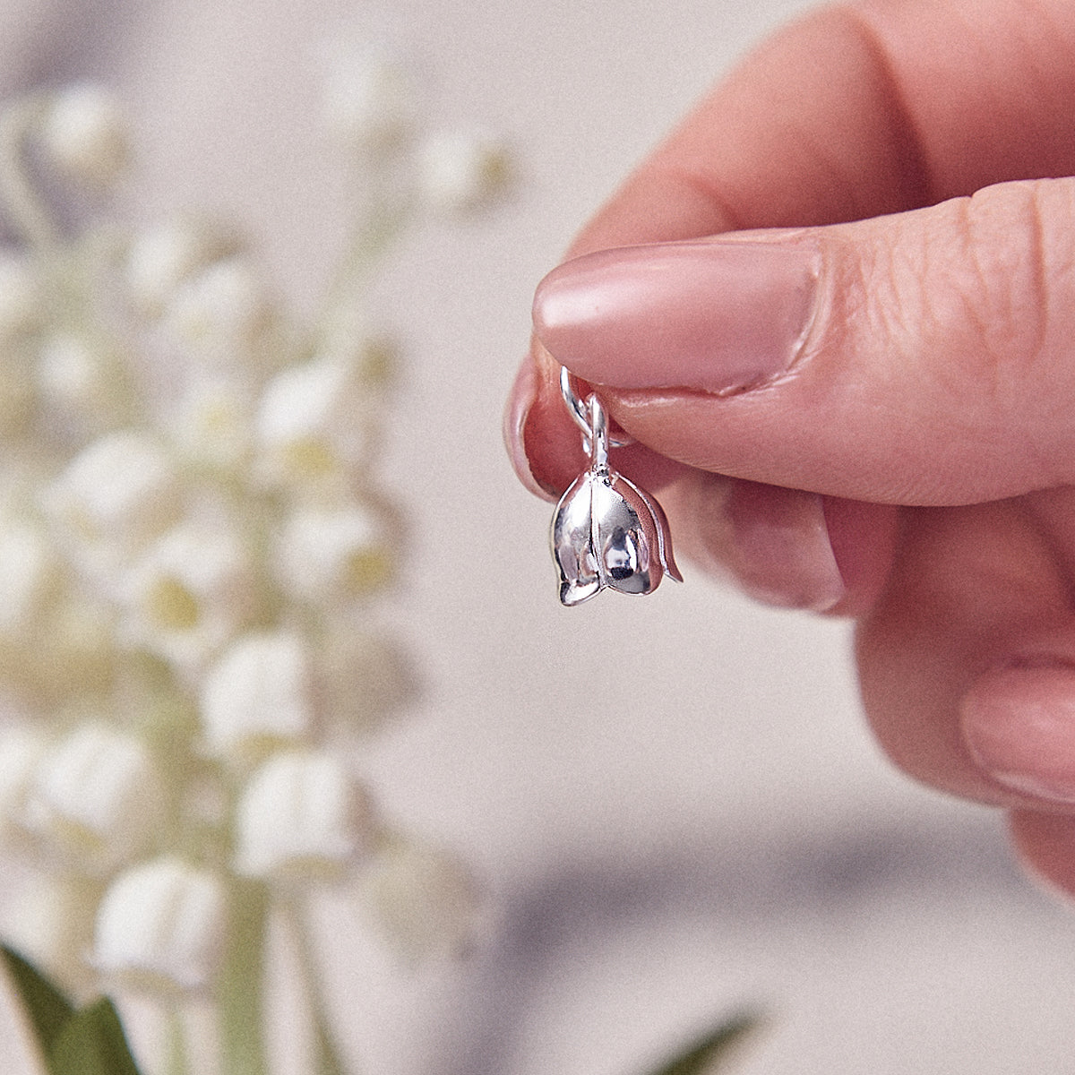 Silver lily of the valley flower charm with delicate details, part of the Scarlett Jewellery collection.