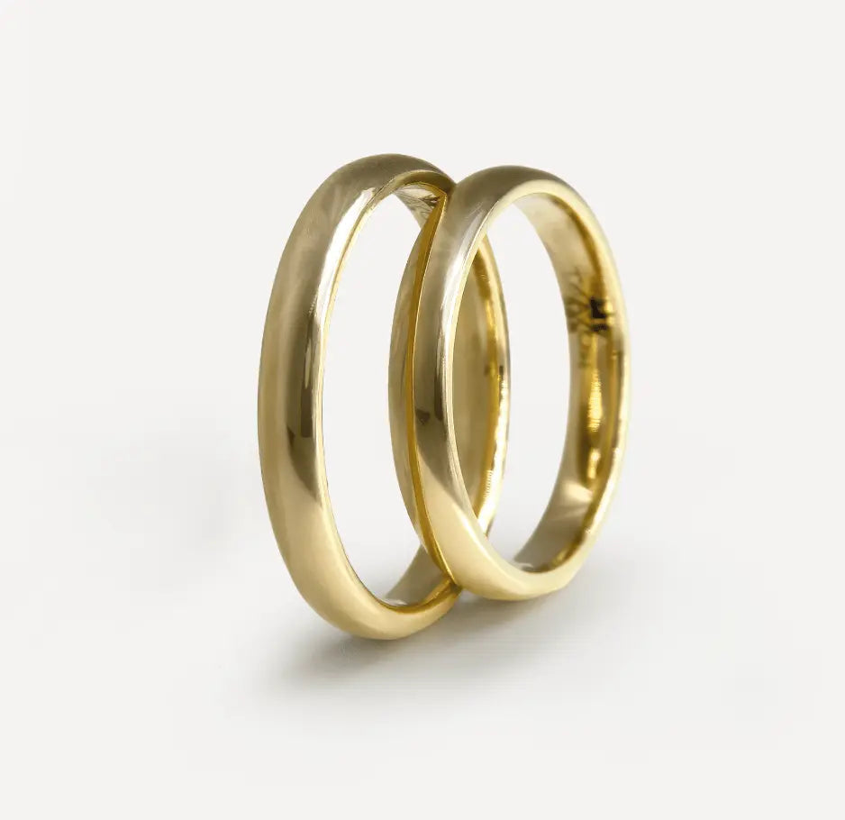 A 3mm gold wedding band featuring a classic lyra design in 9ct, 14ct, or 18ct gold by Majestic Jewellery.