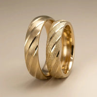 A 5mm gold wedding band with diagonal contrast design in 9ct, 14ct, or 18ct gold by Majestic Jewellery