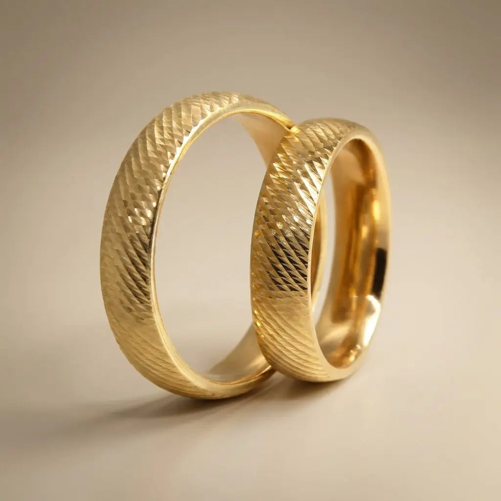 A 5mm gold wedding band with a diagonal weave texture in 9ct gold, shown against a soft background by Majestic Jewellery.