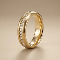 A 4mm gold wedding band from the Celeste Diamond Line in 14ct gold, featuring a sleek polished finish and subtle diamond deta