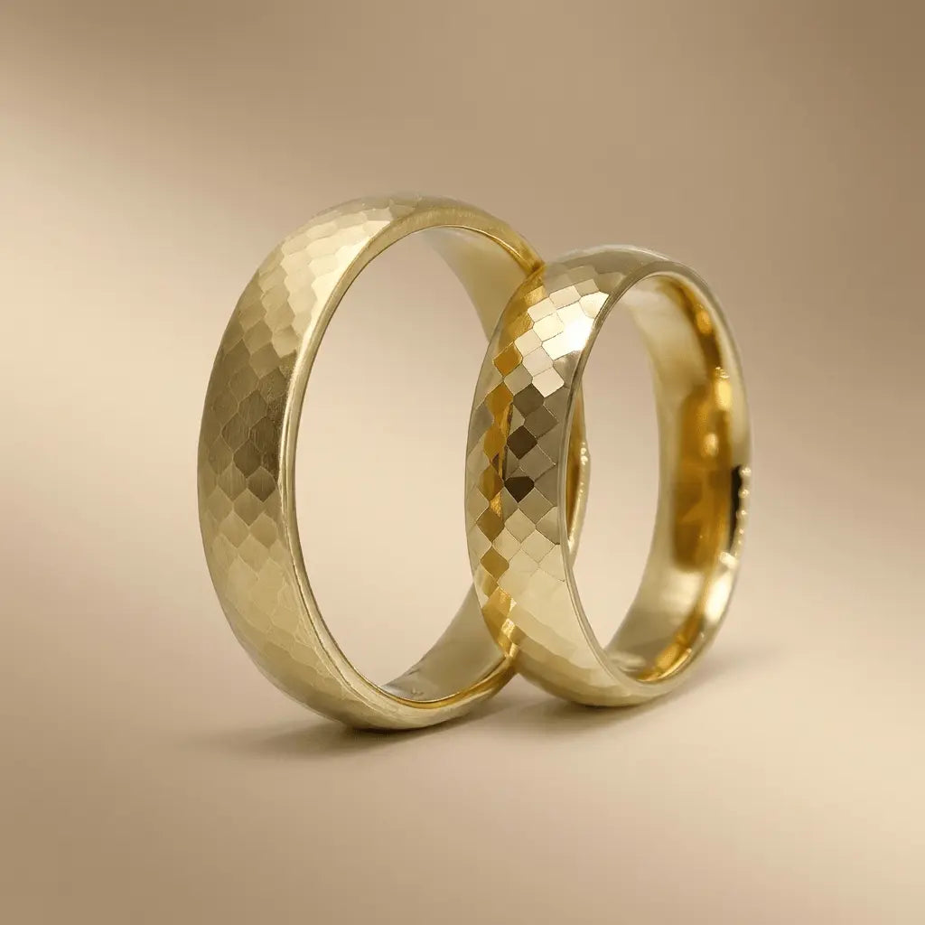 A 5mm hexa faceted gold wedding band in 9ct gold displayed on a white background by Majestic Jewellery.