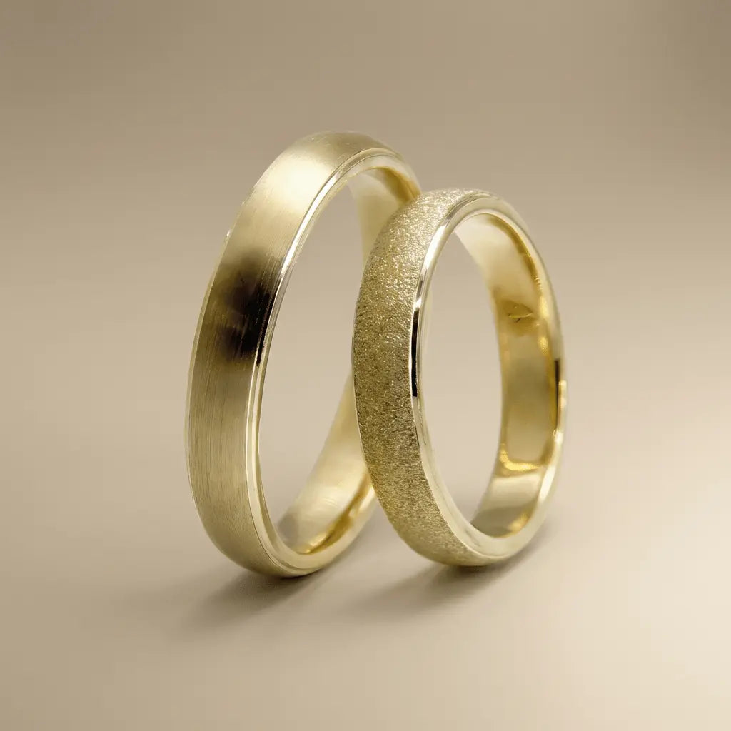 A 4mm gold wedding band with minimal texture and satin finish in 9ct gold, shown as a close-up of the ring's surface by Majes