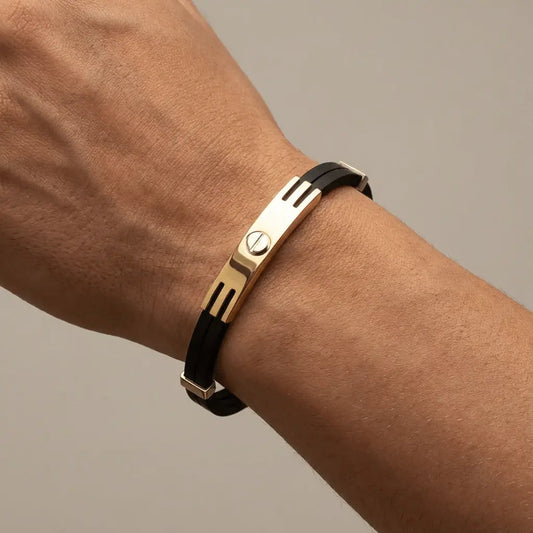 A modern black bracelet with 14ct gold screw details by Majestic Jewellery