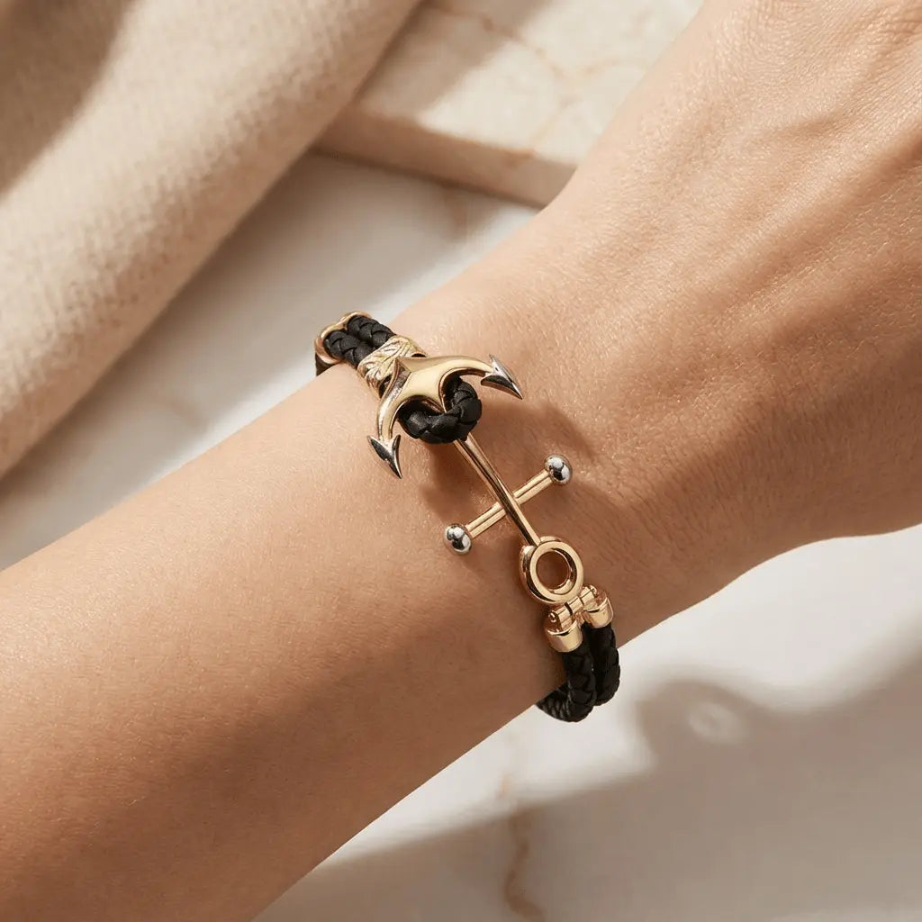 A nautical anchor bracelet with double braided design in 14ct gold by Majestic Jewellery.