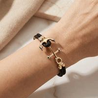 A nautical anchor bracelet with double braided design in 14ct gold by Majestic Jewellery.
