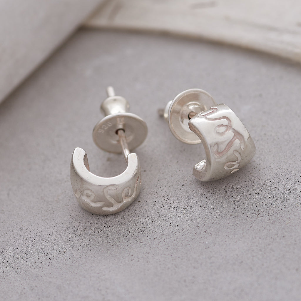Silver hoop earrings with a delicate chain detail by Scarlett Jewellery